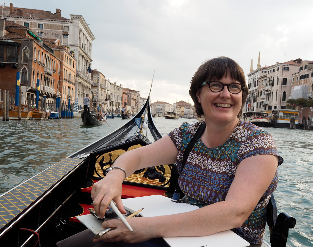 Liz Steel sketching on gondola Venice